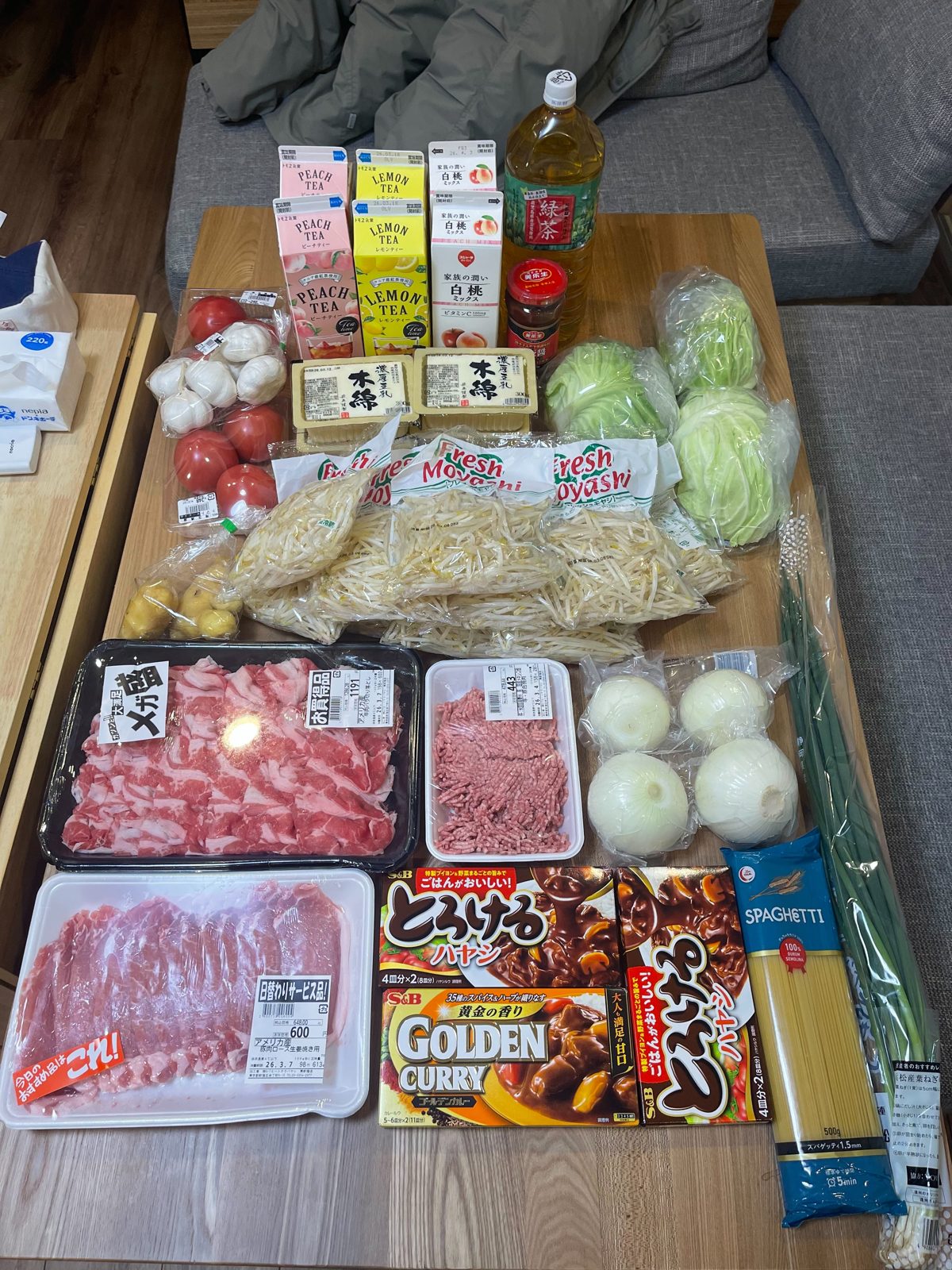 His groceries. He says his days in Tokyo are split roughly half eating out, half cooking at home.